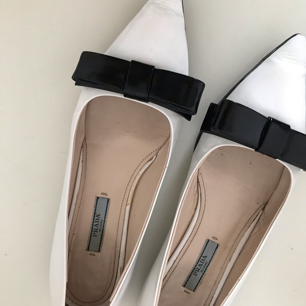 Authentic white Prada flats with black bow